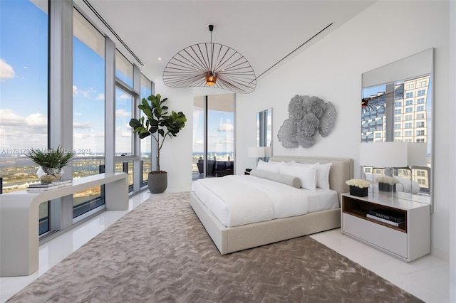 bedroom with floor to ceiling windows