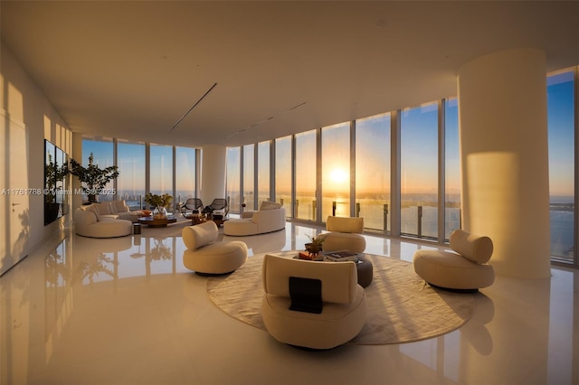 living area featuring a water view and expansive windows