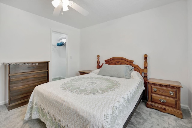 bedroom featuring a ceiling fan, carpet, baseboards, and a closet