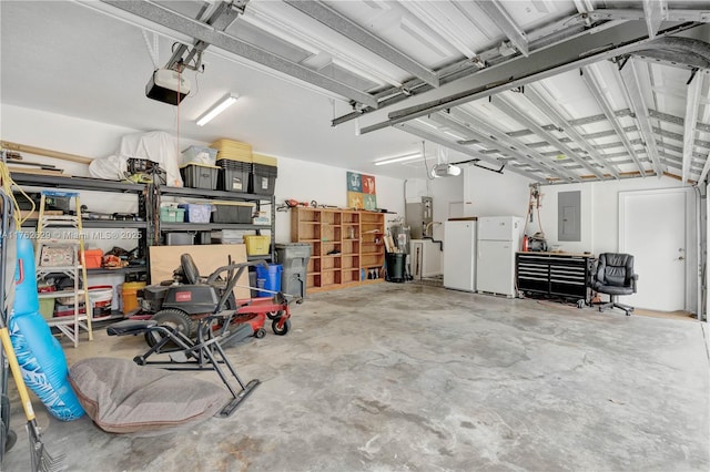 garage with electric panel, a garage door opener, and freestanding refrigerator