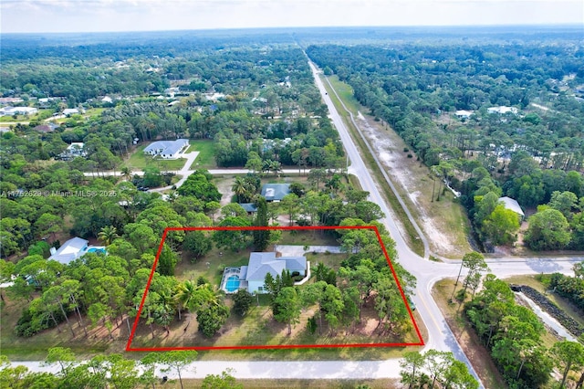 aerial view with a wooded view