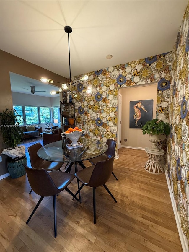 dining room with wood finished floors and baseboards