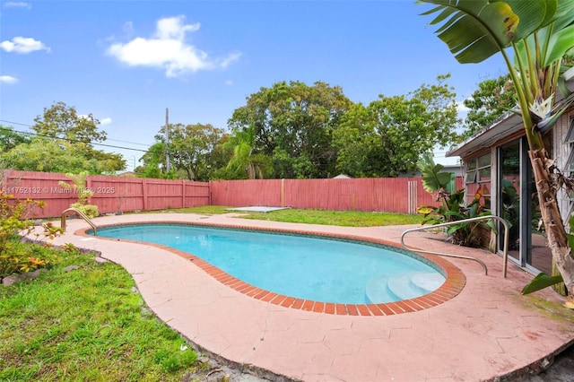 view of swimming pool featuring a patio area, a fenced backyard, and a fenced in pool