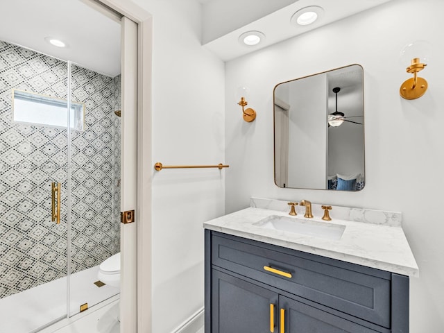 full bath with recessed lighting, vanity, a shower stall, and toilet