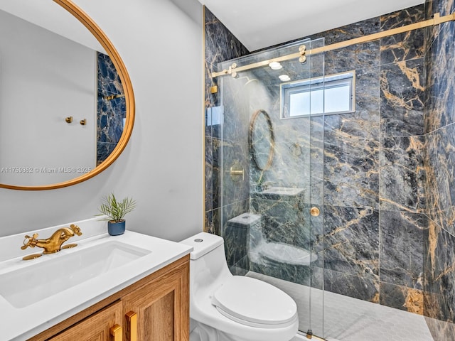 full bath with a marble finish shower, toilet, and vanity