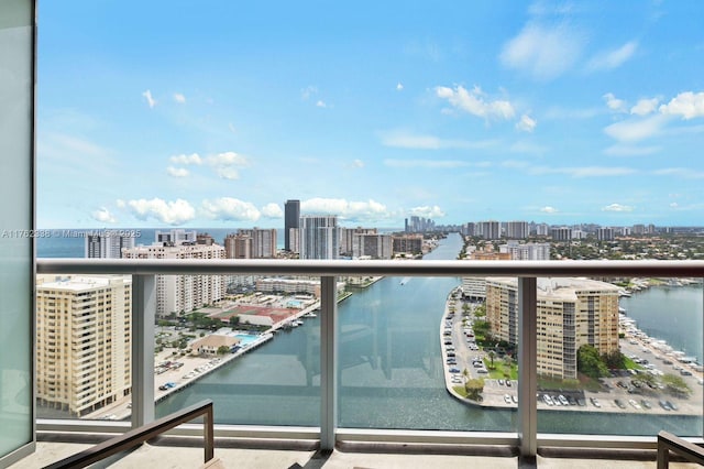 balcony with a view of city and a water view