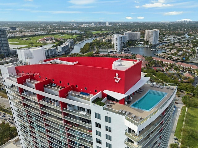 birds eye view of property featuring a water view and a city view