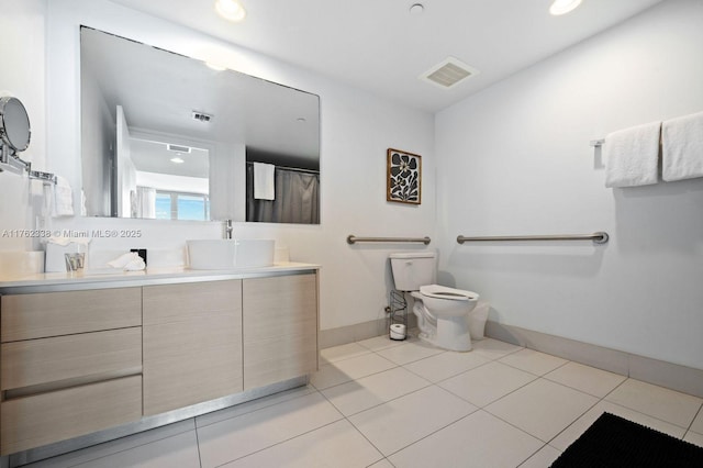 full bath featuring visible vents, toilet, vanity, and tile patterned flooring