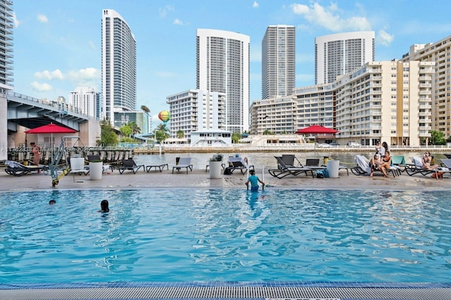 view of swimming pool with a view of city