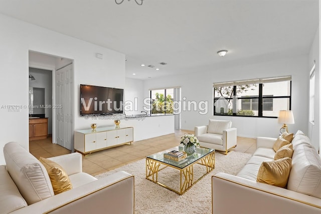 tiled living area with recessed lighting and visible vents