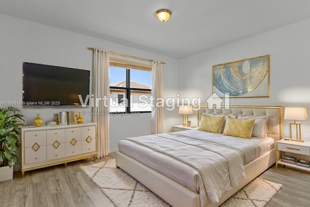 bedroom with wood finished floors