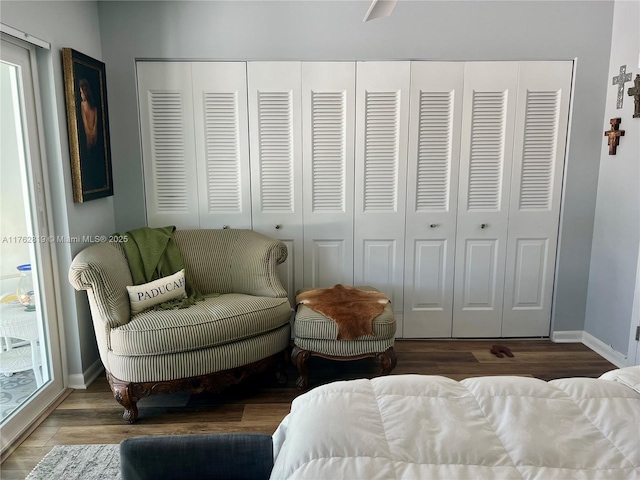 bedroom featuring baseboards and wood finished floors