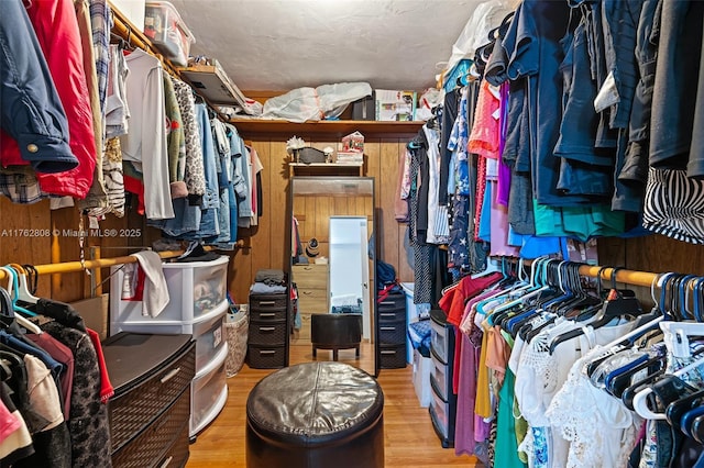 walk in closet featuring wood finished floors