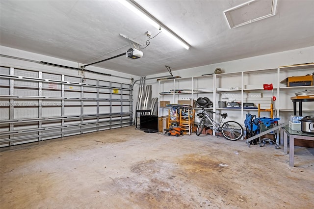 garage featuring a garage door opener