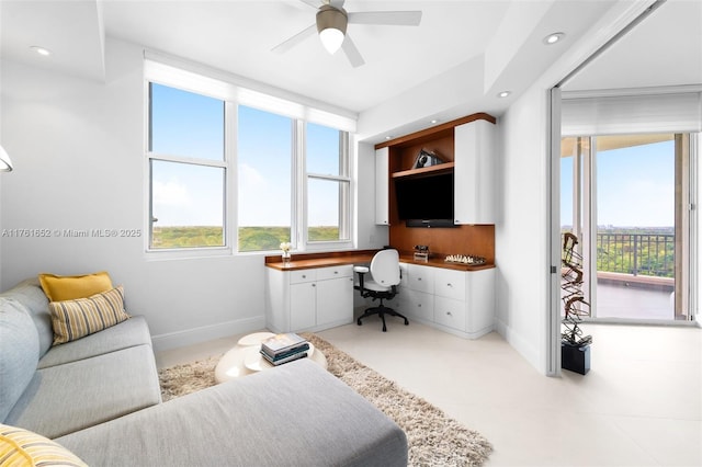 office area featuring recessed lighting, ceiling fan, built in study area, and baseboards