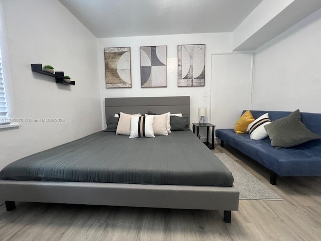 bedroom featuring wood finished floors