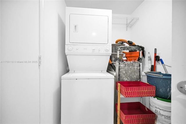 laundry area featuring laundry area and stacked washer / drying machine