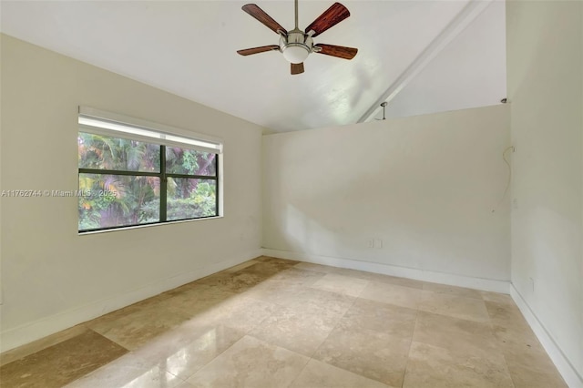 spare room featuring baseboards, a ceiling fan, and vaulted ceiling