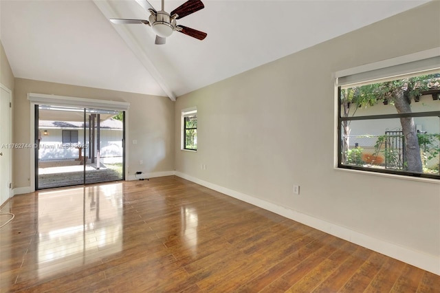 spare room featuring hardwood / wood-style flooring, high vaulted ceiling, baseboards, and ceiling fan