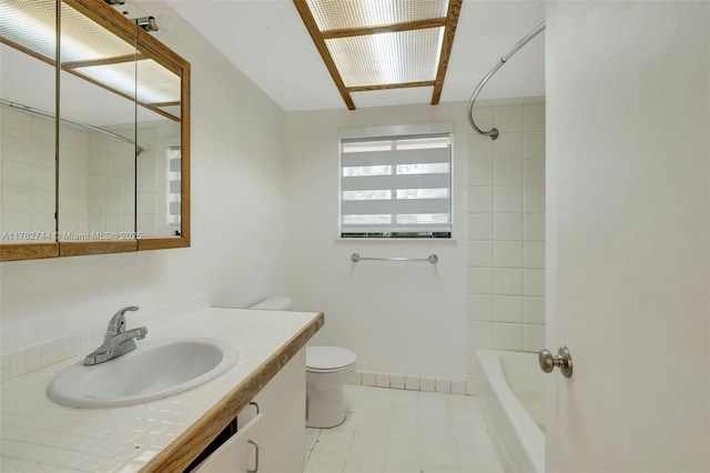 bathroom with shower / bath combination, toilet, and vanity