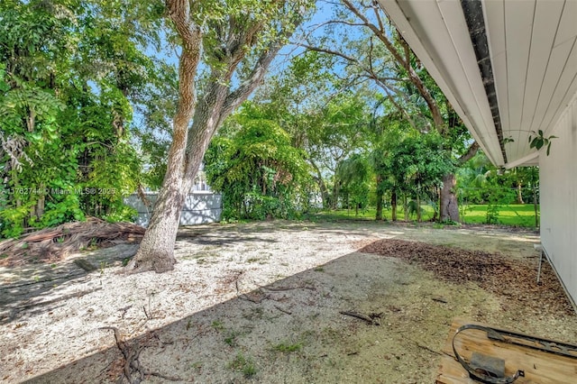 view of yard with a patio and fence