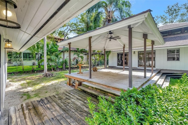 wooden deck with a gazebo and fence