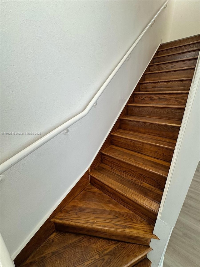 stairs featuring baseboards