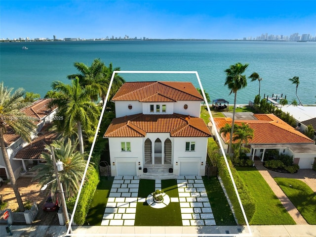 birds eye view of property with a water view