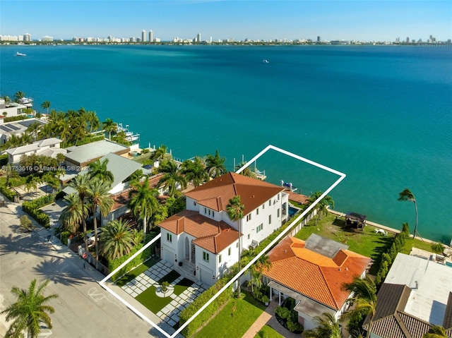 birds eye view of property featuring a water view