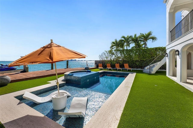 view of pool with stairway, a pool with connected hot tub, a yard, and fence