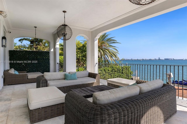 view of patio / terrace featuring a water view and an outdoor hangout area