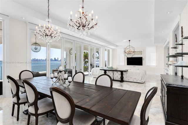 dining room featuring a notable chandelier, recessed lighting, marble finish floor, and baseboards