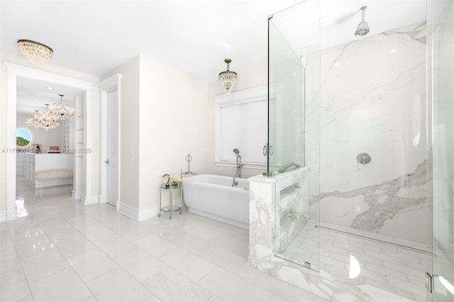 bathroom with baseboards, a bathing tub, a marble finish shower, a notable chandelier, and marble finish floor