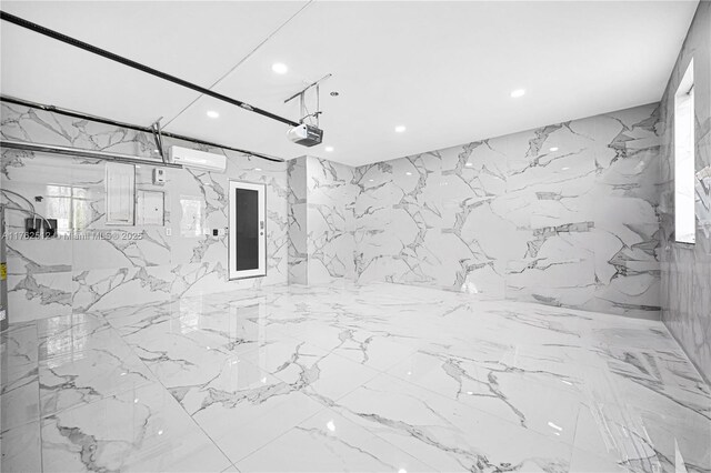 bathroom featuring recessed lighting, electric panel, and stone wall