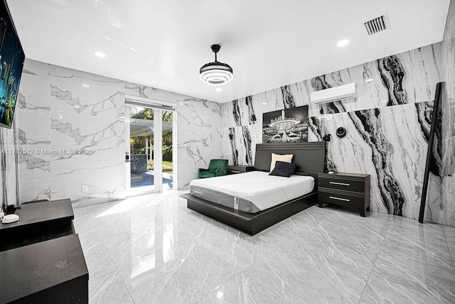 bedroom featuring access to outside, stone wall, marble finish floor, and a wall mounted air conditioner