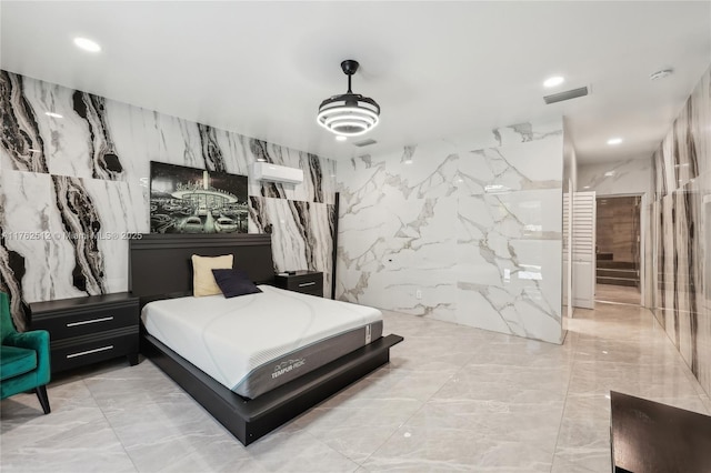 bedroom featuring visible vents, recessed lighting, and marble finish floor