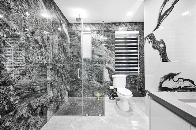 bathroom with marble finish floor, tile walls, toilet, vanity, and a marble finish shower