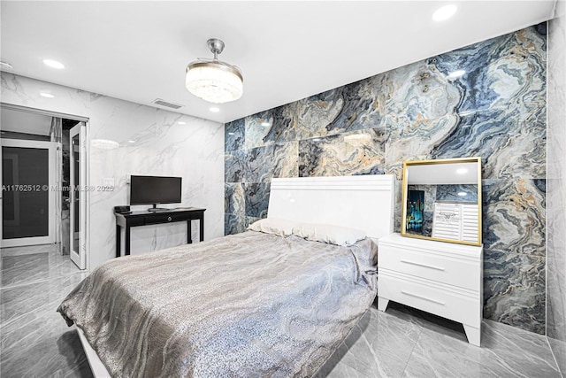 bedroom featuring visible vents, recessed lighting, and marble finish floor
