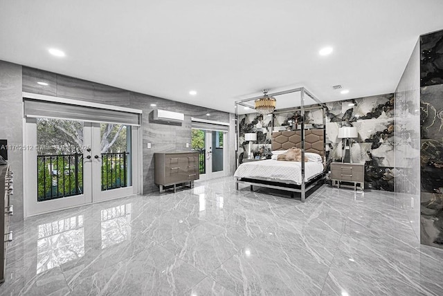 bedroom with marble finish floor, french doors, tile walls, and stone wall