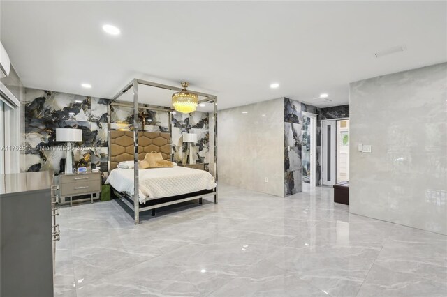 bedroom with recessed lighting and marble finish floor