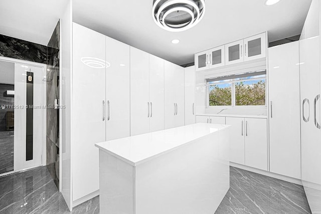 spacious closet with marble finish floor