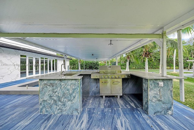 deck with exterior kitchen, outdoor wet bar, and a sink