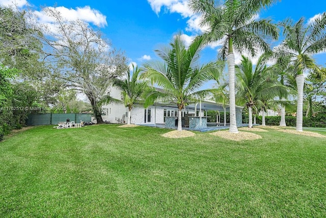 view of yard featuring fence