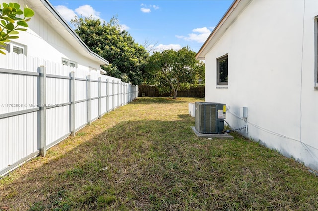 view of yard featuring central air condition unit and fence private yard