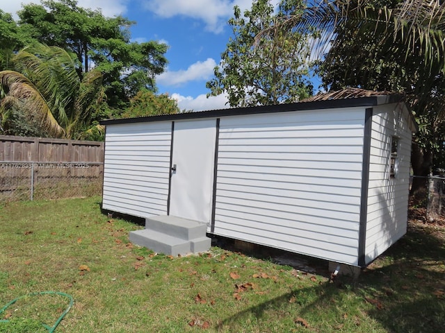 view of shed with fence