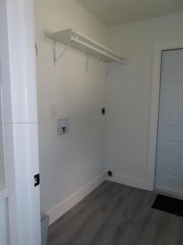 laundry area featuring baseboards, dark wood finished floors, washer hookup, laundry area, and electric dryer hookup