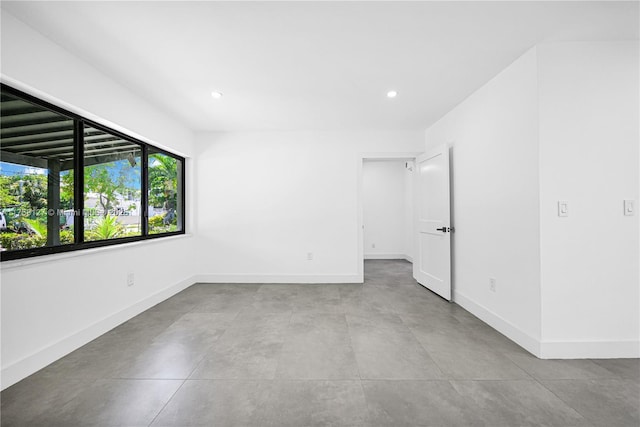 2261 SW 26th St, Miami, FL 33133 - unfurnished room with baseboards, recessed lighting, and concrete floors