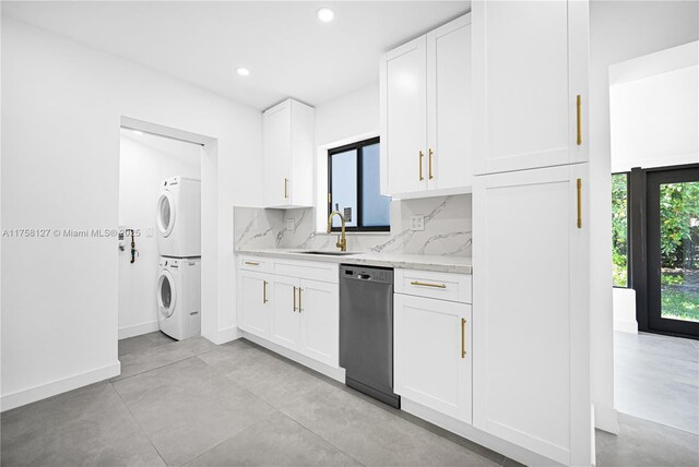 2261 SW 26th St, Miami, FL 33133 - kitchen featuring stacked washer / drying machine, dishwashing machine, a sink, white cabinetry, and recessed lighting