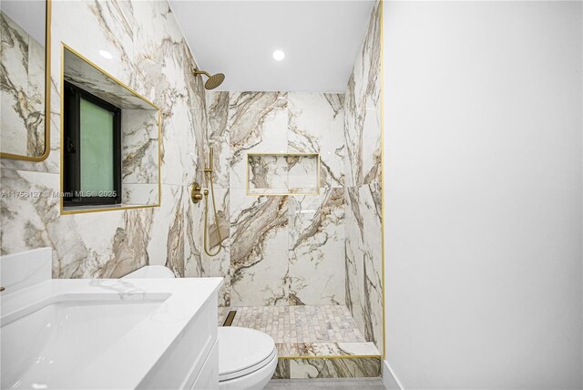 2261 SW 26th St, Miami, FL 33133 - bathroom featuring toilet, marble tiled floors, a marble finish shower, recessed lighting, and vanity