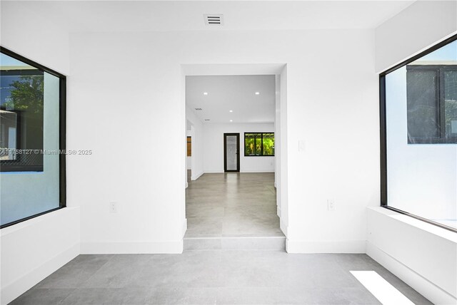 2261 SW 26th St, Miami, FL 33133 - hall featuring recessed lighting, baseboards, and finished concrete flooring